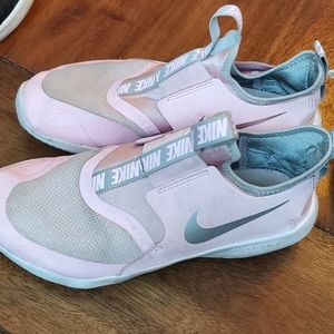 Pink and gray Nike slip on